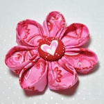 Como fazer flores kanzashi de um tecido com as próprias mãos