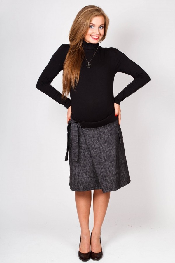 Costumamos roupas para mulheres gravidas de mãos dadas - uma saia, um vestido, uma calça
