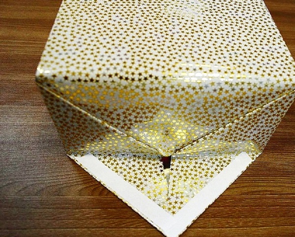 Como embalar um presente em um papel-presente