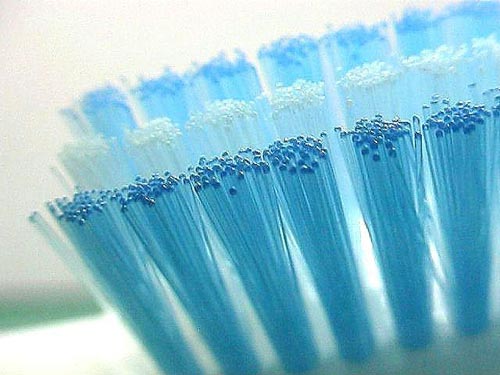 Com que frequência devo mudar minha escova de dentes